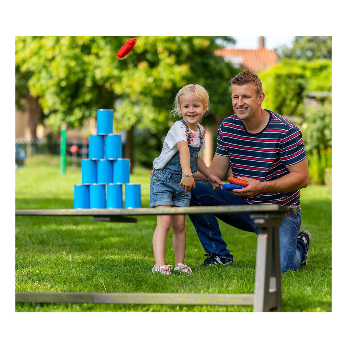 Outdoor play throwing cans