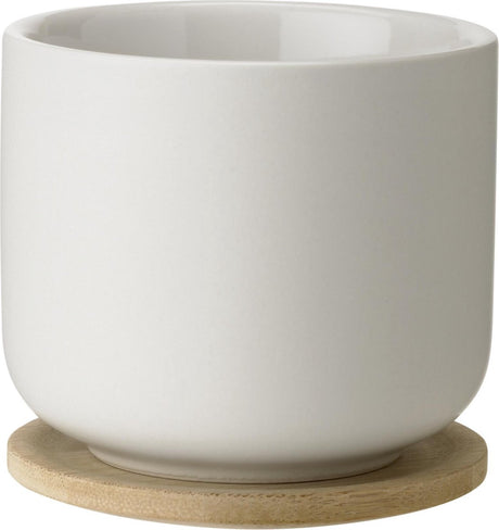 Stelton theo mok met onderzetter - zand
