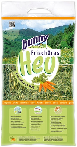 Bunny nature fresh grass hay with carrot