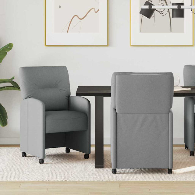 Vidaxl eetkamerstoelen met wieltjes 2 st stof lichtgrijs